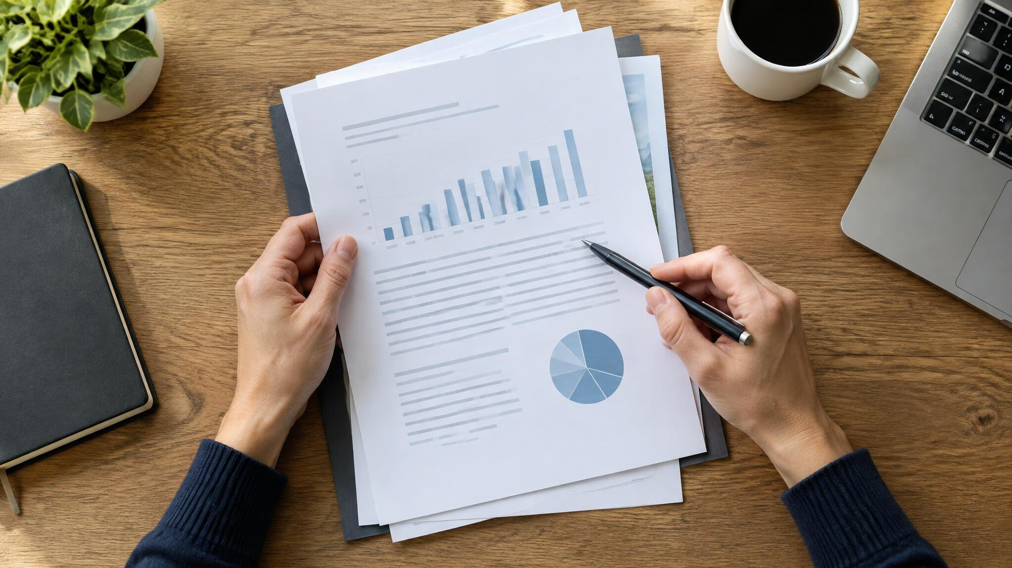 Documents and pen on a desk being reviewed