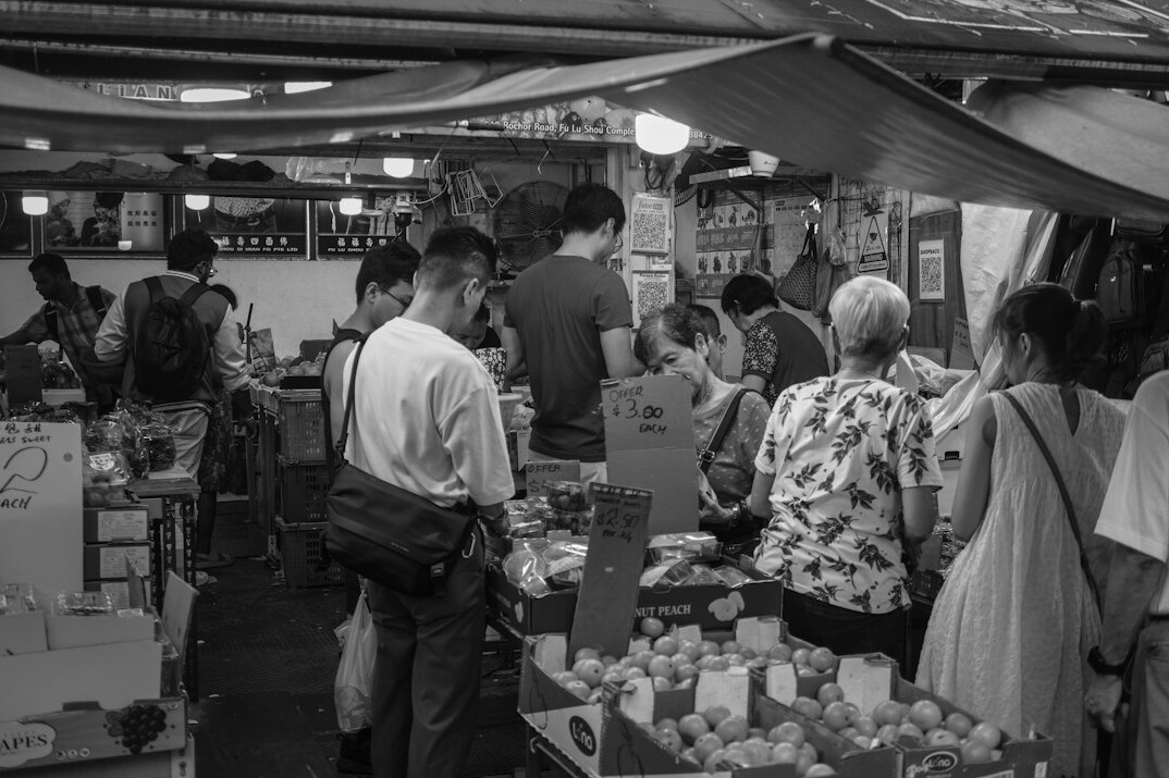 store detective observing crowd in busy shop